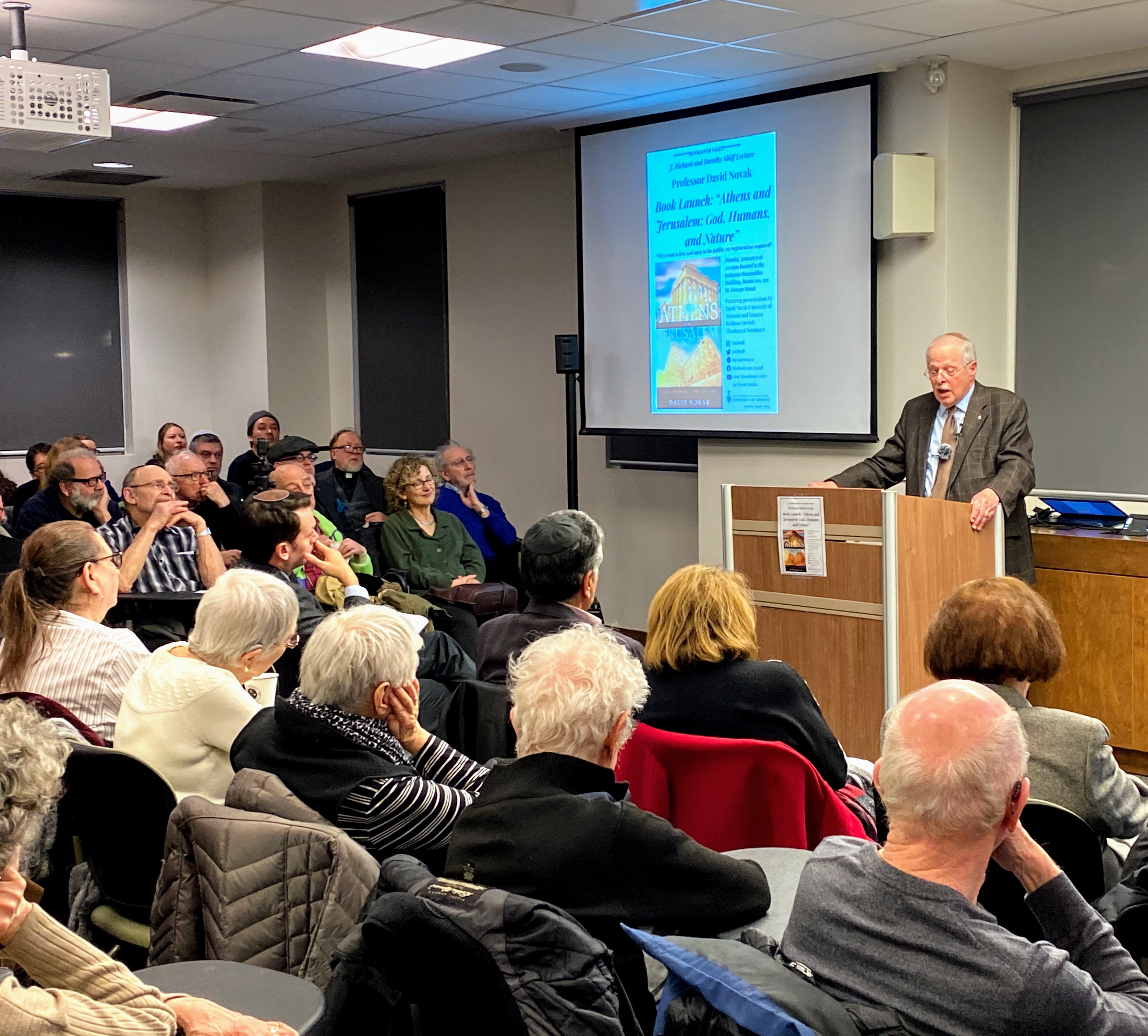 Photo of David Novak speaking at his book launch at the ATCJS